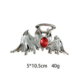 Gothic bat wing hair claw clip detail, metal shark clip with red crystal and halo decor.