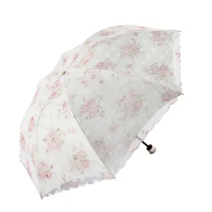 Parapluie de soleil floral pour femmes protection UV bordure en dentelle élégant accessoire.