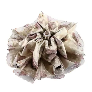 Elegant triple-fold floral umbrella with double lace hem, beautiful rose-shaped folding design.