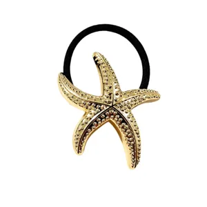 Gouden zeester haarband met getextureerde metalen afwerking voor stijlvolle paardenstaart.