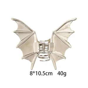 Gothic bat wing hair claw clip for women, silver metal shark clip for thick hair styling.