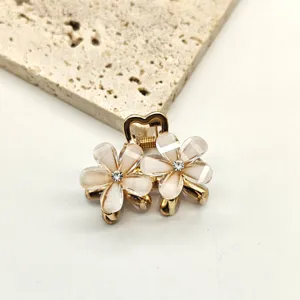 Mini floral hair claw clip with crystal rhinestones, cute metal hair accessories for women.