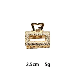 Mini gold alloy hair claw clip featuring geometric cutout design and elegant texture, 2.5cm.