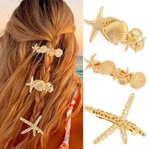 Gold starfish and seashell hair clips set, elegant metal spring barrettes for women hair styling.