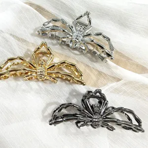 Metal spider hair claw clip detail, gothic style large shark clip in silver, gold and black.