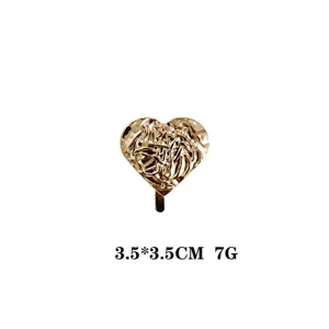 Epingle a cheveux coeur dore pince queue de cheval metal abstrait accessoire coiffure chic