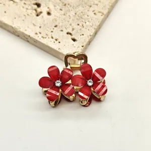 Mini red crystal flower hair claw clip detail shot, elegant metal side hair accessory.