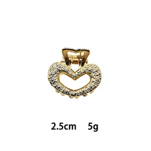 Mini gold heart hair claw clip, 2.5cm alloy small hair accessory for daily styling.
