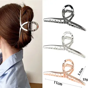 Large metallic hair claw clip with irregular liquid design, elegant hair accessory for thick hair.