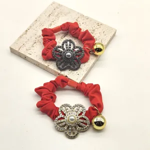 Rhinestone flower hair scrunchie set, elastic ponytail holder with cute gold bell detail.
