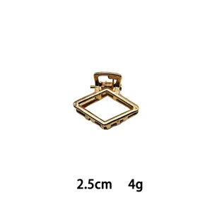 Gold mini geometric hair claw clip detail shot, compact alloy hair accessory, 2.5cm.