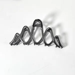 Large metal hair claw clip in sleek black wave design, sturdy hair catcher for thick hair styling.