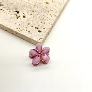 Mini pink five-petal flower hair claw clip with crystal center, ideal for cute daily hairstyles.