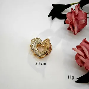Gouden legering hol hart haar klauw clip, kleine schattige haarspeld voor dagelijkse styling.