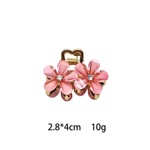 Mini crystal flower hair claw clip in pink and gold, sweet daily hair accessory for women.