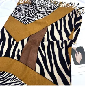 Detailed view of the women's fashion zebra print cashmere-feel tassel scarf and warm winter shawl.