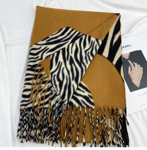 Women winter warm imitation cashmere scarf with trendy zebra print and tassel fringe design.
