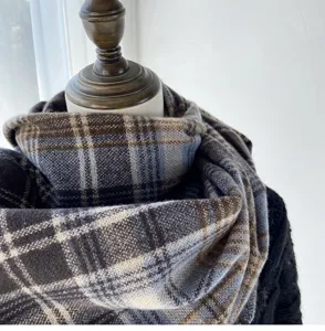 Detailed view of the cozy retro plaid winter scarf showcasing soft texture and warm drape design.