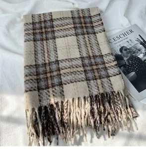 Cozy plaid winter scarf detail featuring soft imitation cashmere fabric and classic fringe trim.