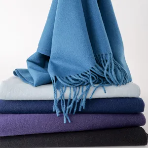 Detail view of solid color imitation cashmere women scarf with fringe, soft winter shawl.
