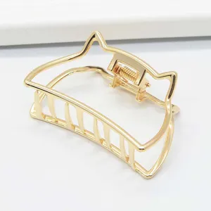 Gold metal hair claw clip detail, minimalist cat ear design, strong grip for thick hair daily wear.