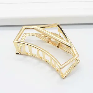 Minimalist geometric gold metal hair claw clip detail, large size alloy hair accessory.