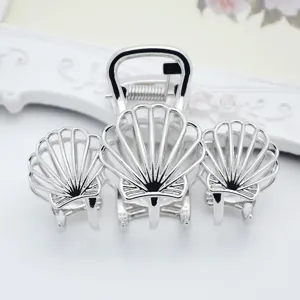 Minimalist silver zinc alloy hair claw clip with elegant shell design for women daily hair styling.