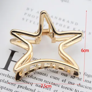 Gold star hair claw clip detail shot, minimalist metal hair accessory for daily styling.