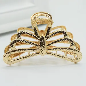 Gold metal hair claw clip detail, minimalist hair accessory for women styling daily use.