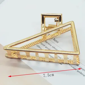 Minimalist zinc alloy hair claw clip, gold geometric triangle hair accessory for women.