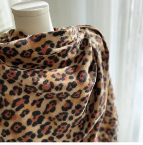 Classic leopard print cashmere-feel winter scarf with fringe detail, cozy and warm for women.