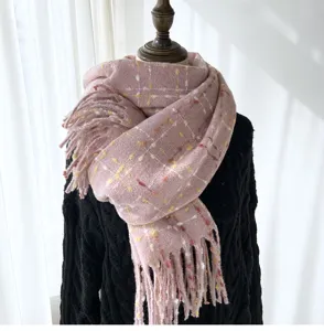 Detailed view of women winter pink plaid scarf with fringe, soft cashmere-feel fabric design.