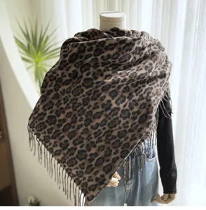 Detail view of the classic leopard print women tassel shawl, soft imitation cashmere scarf.