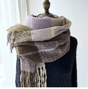 Close-up detail of the cozy plaid cashmere-feel tassel scarf in purple and brown tones.