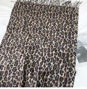 Detailed close-up of the classic leopard print winter scarf, showcasing soft texture.