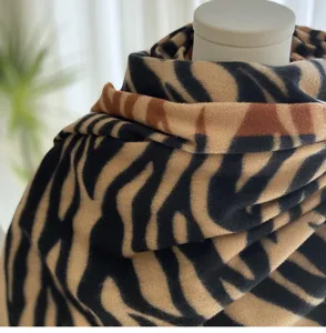 Close-up detail of the autumn winter imitation cashmere scarf featuring a chic animal print design.