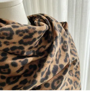 Classic leopard print scarf detail shot, soft imitation cashmere texture, warm winter shawl.