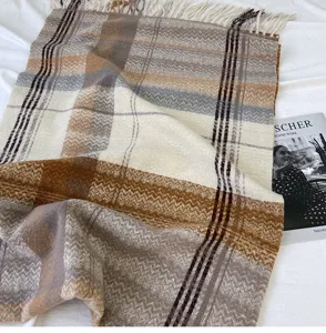 Cozy winter thickened imitation cashmere plaid tassel scarf detailed view in warm neutral tones.
