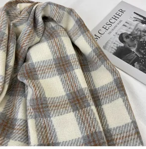 Detailed view of a soft winter plaid scarf, warm cashmere-feel tassel shawl for cozy cold weather.