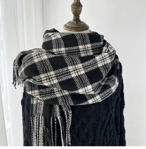 Classic black and white plaid scarf for women winter warm long tassel design soft shawl accessory.