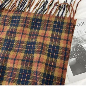 Detailed view of the stylish plaid scarf with tassels, soft cashmere-feel fabric, warm & cozy.