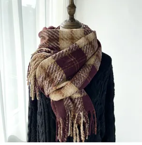 Detailed view of women's autumn winter vintage plaid imitation cashmere scarf with chic tassel.