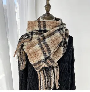 Detailed view of the thick plaid cashmere-feel scarf, cozy and warm for cold winter days.