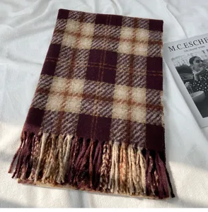 Detailed view of the autumn winter plaid imitation cashmere scarf with elegant fringe design.