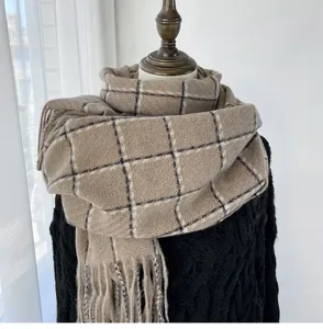Detailed view of women's autumn winter plaid scarf, warm imitation cashmere shawl.