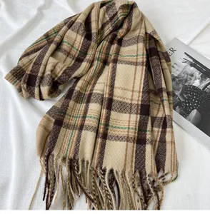 Detailed view of winter thickened imitation cashmere plaid scarf with cozy fringe tassels.