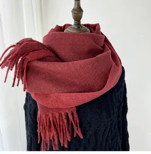 Cozy red winter imitation cashmere scarf with chic tassels, soft warm neck accessory.