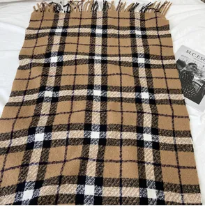 Classic plaid winter scarf detail, cozy thick warm tassel shawl, stylish retro check pattern.