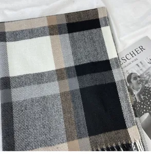 Classic black white grey and camel plaid tassel scarf for autumn and winter warmth.