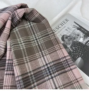 Close-up detail of retro Maillard plaid scarf, showing soft winter texture and cozy design.